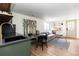 A spacious living room provides room to sit and eat next to the kitchenette area at 4565 Elm Ct, Denver, CO 80211