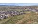 This is an aerial shot of the community, displaying the layout of homes, green spaces, and surrounding landscape at 9130 Fraser River, Littleton, CO 80125