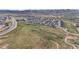 This aerial view shows the community, nearby roads, and open spaces, providing a sense of location at 9130 Fraser River, Littleton, CO 80125