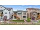 This backyard features a cozy balcony, a well-kept lawn, and is surrounded by a lovely white picket fence at 9130 Fraser River, Littleton, CO 80125