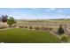 Low-maintenance backyard with artificial turf and scenic views at 9130 Fraser River, Littleton, CO 80125