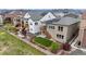 This backyard includes a balcony, a well-manicured lawn, and a charming white picket fence, with mountain views at 9130 Fraser River, Littleton, CO 80125