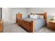 Cozy bedroom featuring wood furniture, grey walls, and soft carpet flooring at 9130 Fraser River, Littleton, CO 80125
