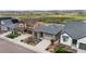 This is an exterior view showcasing the driveway, landscaping, and the home's architectural details at 9130 Fraser River, Littleton, CO 80125