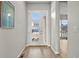 Bright foyer featuring a modern door with glass panels and wood-look flooring at 9130 Fraser River, Littleton, CO 80125