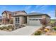 Inviting single Gathering home featuring a landscaped front yard and an attached garage at 9130 Fraser River, Littleton, CO 80125