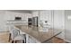 Modern kitchen island with seating, stainless steel appliances, and plenty of countertop space at 9130 Fraser River, Littleton, CO 80125