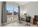 Bright home office with large windows, gray curtains, and two work stations at 9130 Fraser River, Littleton, CO 80125