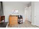 Home office featuring wood-look floors and a drawer with storage at 9130 Fraser River, Littleton, CO 80125