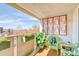 Charming balcony with seating, planters, and a decorative feature wall, perfect for enjoying the outdoors at 1090 N Lafayette St # 504, Denver, CO 80218