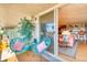 Inviting balcony with comfortable chairs, a view to the living room, and an open-air feel at 1090 N Lafayette St # 504, Denver, CO 80218