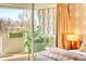 Bedroom featuring a private balcony with outdoor seating and serene neighborhood views at 1090 N Lafayette St # 504, Denver, CO 80218