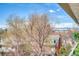 Balcony with a view of mature trees and surrounding neighborhood buildings at 1090 N Lafayette St # 504, Denver, CO 80218