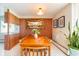 Open dining area with a wooden table set for eight, vintage decor, and ample lighting at 1090 N Lafayette St # 504, Denver, CO 80218