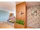 Stylish foyer with unique wallpaper, wood accents, and a glimpse into the living area at 1090 N Lafayette St # 504, Denver, CO 80218
