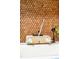 Close-up of vintage sink with classic faucet and mid-century soap dispenser; vintage cork tile backsplash at 1090 N Lafayette St # 504, Denver, CO 80218