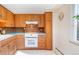 Classic kitchen with blue countertops, wood cabinets, and vintage-inspired decorative details at 1090 N Lafayette St # 504, Denver, CO 80218