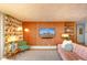 Cozy living room with wood paneling and eclectic decor, perfect for relaxing and entertaining at 1090 N Lafayette St # 504, Denver, CO 80218