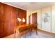 Bedroom featuring built in wood closets and a wood desk, perfect for a home office at 1090 N Lafayette St # 504, Denver, CO 80218