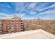 Expansive rooftop view capturing the city skyline, rooftops, and distant mountains, providing a stunning vista at 1090 N Lafayette St # 504, Denver, CO 80218