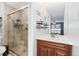 Bathroom with shower, vanity, and updated fixtures at 6462 E Bates Ave, Denver, CO 80222