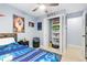 Bright bedroom with built-in shelving and ceiling fan at 6462 E Bates Ave, Denver, CO 80222