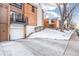 Front exterior view showing garage and landscaping at 6462 E Bates Ave, Denver, CO 80222