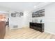 Bright hallway with wood floors and access to the living areas at 6462 E Bates Ave, Denver, CO 80222