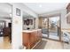 Kitchen with island, wooden cabinets, and stainless steel appliances at 6462 E Bates Ave, Denver, CO 80222