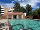 A beautiful outdoor swimming pool featuring clear turquoise water, perfect for relaxation and recreation at 6462 E Bates Ave, Denver, CO 80222