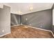 Finished basement with neutral walls and hardwood floors at 302 Linden St, Frederick, CO 80530