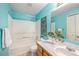 Clean bathroom with light blue walls, a shower/tub combo, and a vanity at 302 Linden St, Frederick, CO 80530