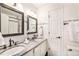 Elegant bathroom with double sinks and subway tile at 302 Linden St, Frederick, CO 80530