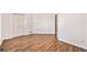 Large bedroom with hardwood floors and access to another room at 302 Linden St, Frederick, CO 80530