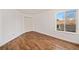 Spacious bedroom with hardwood floors and a double-door closet at 302 Linden St, Frederick, CO 80530