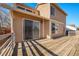 Wooden deck overlooks backyard, providing access to the house at 302 Linden St, Frederick, CO 80530