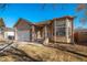 Ranch-style home with a two-car garage and neat landscaping at 302 Linden St, Frederick, CO 80530