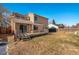 Tan two-story house with a wooden deck and backyard at 302 Linden St, Frederick, CO 80530