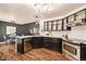 Modern kitchen featuring stainless steel appliances and ample cabinetry at 302 Linden St, Frederick, CO 80530