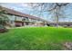 A large green lawn and courtyard at 8870 W Jewell Ave # 11, Lakewood, CO 80232