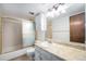 Bathroom with shower-tub combo, vanity and marble countertop at 8870 W Jewell Ave # 11, Lakewood, CO 80232