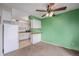 Bright and spacious kitchen with a view of the living space, and with white appliances at 8870 W Jewell Ave # 11, Lakewood, CO 80232