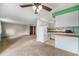 Bright and spacious living space with carpet, with a view of kitchen and neutral wall colors at 8870 W Jewell Ave # 11, Lakewood, CO 80232