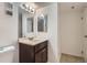 Bathroom with large mirror, vanity with modern faucet, and tile flooring at 14493 E Jewell Ave # 103, Aurora, CO 80012