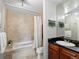 Bathroom featuring vanity with granite countertops and tiled shower/tub at 975 N Lincoln St # 4F, Denver, CO 80203