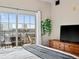 Bright bedroom featuring balcony access and modern dresser at 975 N Lincoln St # 4F, Denver, CO 80203
