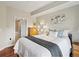 Bright and airy bedroom with modern decor and ensuite bath at 975 N Lincoln St # 4F, Denver, CO 80203