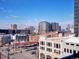 Expansive city view showcasing buildings, a Circle K gas station and street traffic on a clear day at 975 N Lincoln St # 4F, Denver, CO 80203