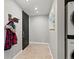 Entryway featuring coat rack, artwork, and in-unit laundry at 975 N Lincoln St # 4F, Denver, CO 80203