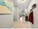Hallway leading to living area, with neutral colors and space for coats and art at 975 N Lincoln St # 4F, Denver, CO 80203